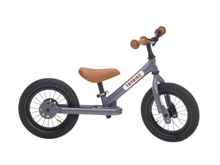 Trybike Steel 2-in-1 loopfiets Grijs met luchtbanden, verstelbaar zadel en stalen frame – geschikt voor kinderen van 15 maanden tot 6 jaar.