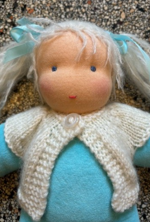 Picture of SALE!!!  Pop Antroposofisch Liselotje licht blauw met wol gebreid vestje Nicky velours met schapenvol vulling